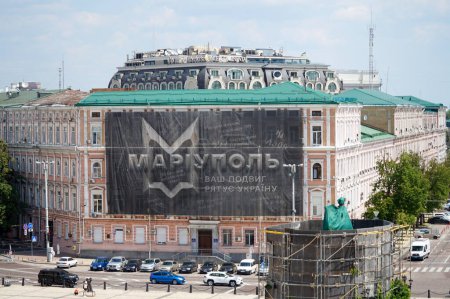 Photo for A large poster on a building in the center of Kyiv with a reminder of Mariupol and Azov. - Royalty Free Image