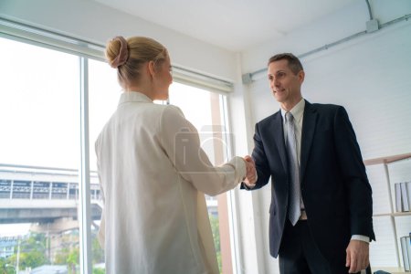Photo for Professinal business man and businesswoman shaking hand in modern office accept cooperation concept - Royalty Free Image
