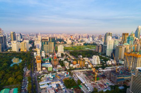Photo for Bangkok downtown city office building with green park sunset aerial view Thailand - Royalty Free Image