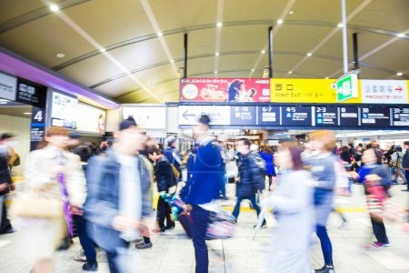 Photo for Motion blur view of passengers rushing, train station background - Royalty Free Image