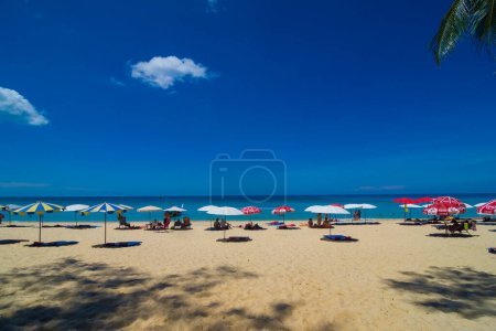 Photo for Beach chairs and umbrellas at sea beach against blue sky, summer vacation - Royalty Free Image