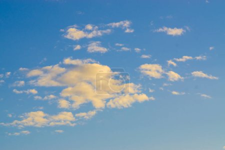 Photo for Blue sky with fluffy clouds, evening sky nature background - Royalty Free Image
