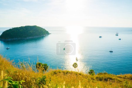 Photo for Sunset on Phuket island. Turquoise sea water with yellow grass, summer vacation concept - Royalty Free Image