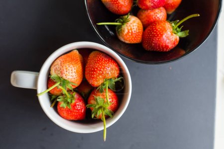 Photo for Fresh strawberries in bowl, top view, organic berries - Royalty Free Image