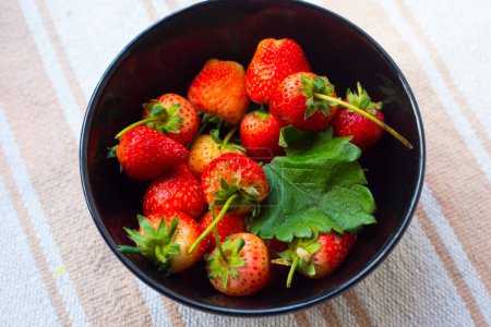 Photo for Fresh strawberries in bowl, top view, organic berries - Royalty Free Image