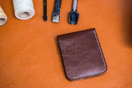 Photo for Handmade of genuine leather wallet bifold on craftsmanship tool, Making wallet - Royalty Free Image