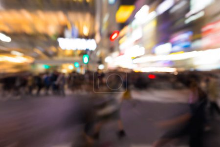 Photo for Blurred people walking in business district with city building, Shibuya Japan - Royalty Free Image