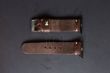Photo for Craftsmanship of genuine leather watch strap on black - Royalty Free Image