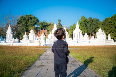 Photo for 2 Year asian boy enjoying travel in buddhist temple Chiangmai Thailand - Royalty Free Image