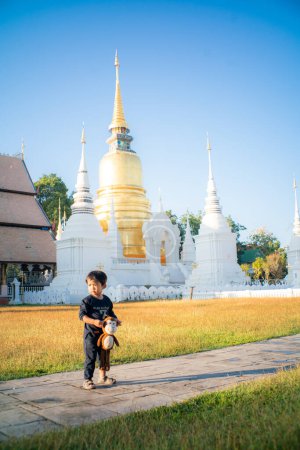 Photo for 2 Year asian boy enjoying travel in buddhist temple Chiangmai Thailand - Royalty Free Image