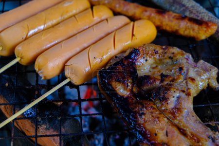 Photo for Chicken sausages grilled on charcoal fire with pork meat - Royalty Free Image