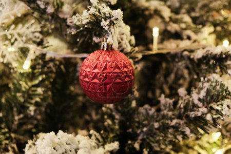 Photo for Christmas ball on pine tree branch blurred background happy new year - Royalty Free Image