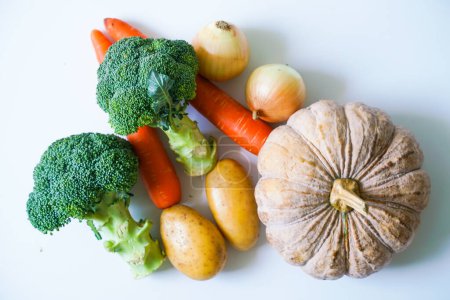 Photo for Group of green brocoli yellow pumpkin and orange carrot vegetable on white background - Royalty Free Image