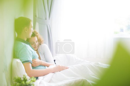Photo for Love couple lying on white bed in morning happy and carring together relaxtion of love - Royalty Free Image