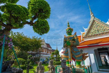 Photo for Statues of Giants in gate of temple demon guardians at Wat Arun. Famous temple in Bangkok, Thailand. - Royalty Free Image