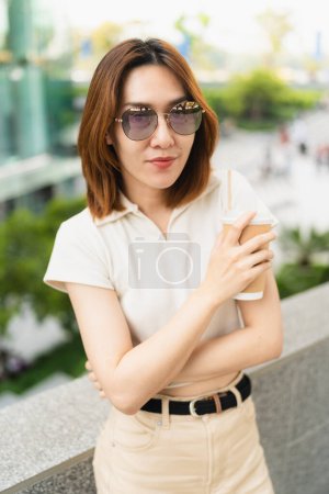 Photo for Smart business asian woman drink coffee use smartphone in city business office building outdoor recreation business woman - Royalty Free Image