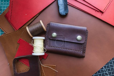 Photo for Genuine vegetable tanned leather working leather wallet on leather background craftmanship - Royalty Free Image