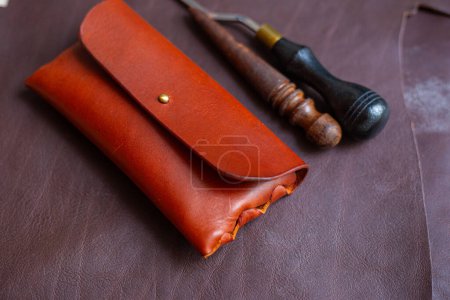 Photo for Leather glasses case handmade craftmanship working on leather copy space - Royalty Free Image