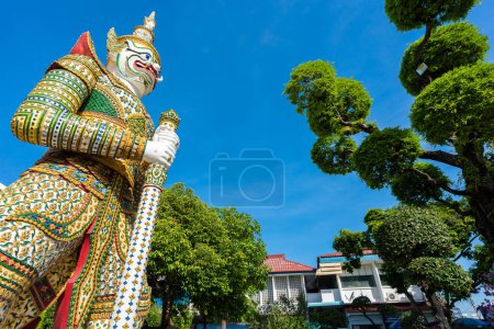 Photo for Statues of buddhist giants demon guardians at Gates to Ordination Hall Wat Arun. Famous temple in Bangkok, Thailand. - Royalty Free Image