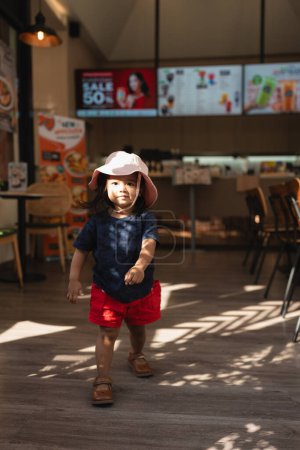Photo for Little beautiful 3 year kindergarten girl in coffee shop - Royalty Free Image