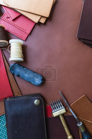 Photo for Genuine Italy vegetable tanned leather working leather wallet brass on leather background craftmanship - Royalty Free Image