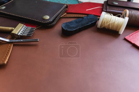 Photo for Genuine Italy vegetable tanned leather working leather wallet brass on leather background craftmanship - Royalty Free Image