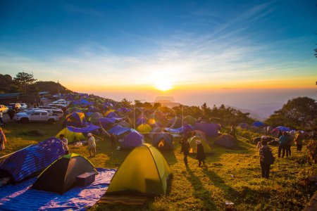 Photo for Group of colourful camping tent on mountain hill sunrise view nature adventure - Royalty Free Image