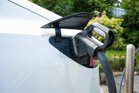 Photo for Power supply EV fuel Plug in hybrid car connect to electric vehicle for charge to the battery. Charging technology industry - Royalty Free Image