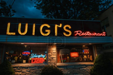 Photo for Luigis Restaurant vintage neon sign at night, Ridgefield Park, New Jersey - Royalty Free Image