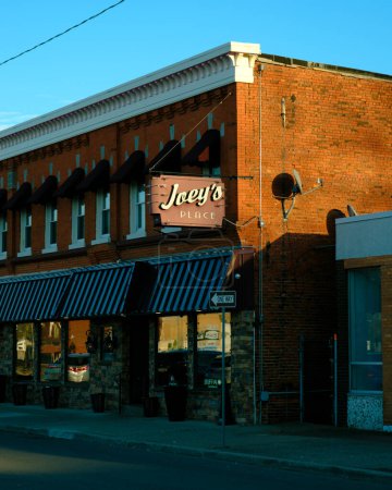 Photo for Joeys Place vintage sign and brick building, Tonawanda, New York - Royalty Free Image