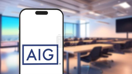 Photo for New York, USA - 26 March 2024: AIG American International Group Company Logo on Phone, Illustrative Editorial. - Royalty Free Image
