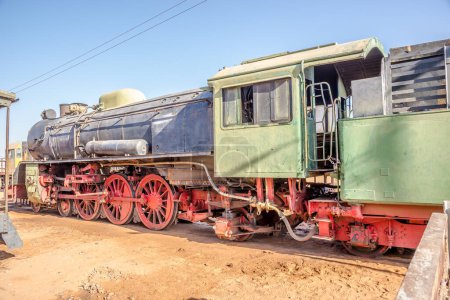 Photo for WADI RUM,JORDAN - OCTOBER 26,2023 - Old Locomotive at Train station of Wadi Rum. Wadi Rum is a valley cut into the sandstone and granite rock in southern Jordan. - Royalty Free Image