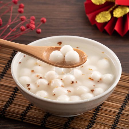 Photo for Little sweet osmanthus soup white tangyuan with decoration with fu word means good fortune. - Royalty Free Image