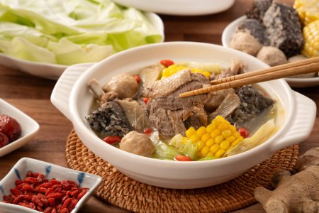Delicious ginger duck stew hot pot soup with fresh vegetables in Taiwan.