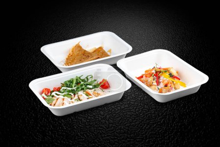 Photo for A variety of healthy and delicious meal options in eco-friendly takeaway containers. - Royalty Free Image