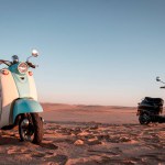 Two Retro scooters at sunset in the golden sand of the Namib Desert
