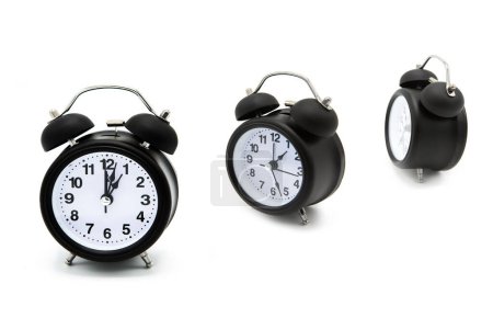 Foto de Many alarm clock isolated on white background. Copy space. Time. The concept of time management, accuracy, time planning, outgoing time. - Imagen libre de derechos