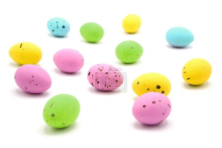 Scattered colorful glitter easter eggs isolated on a white background. Happy easter! 