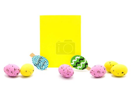 Greeting blank card with clothespins and colored eggs. Copy space. Free space for text. Happy easter!