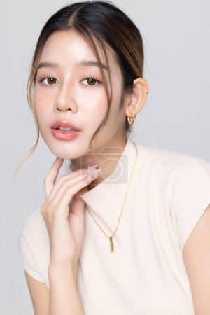 Portrait of young Asian business woman with K-beauty make up style.