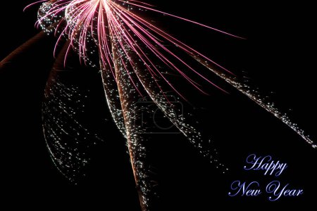 Téléchargez les photos : Real fireworks photography and abstract colorful fireworks background with Happy New Year lettering - en image libre de droit