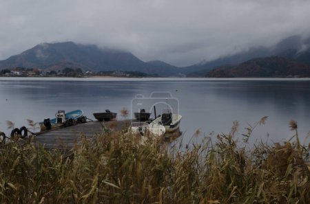 Photo for Lake Kawaguchi, November 22, 2017: Boats on a pier. Yamanashi Prefecture. Fuji-Hakone-Izu National Park. Honshu. Japan. - Royalty Free Image