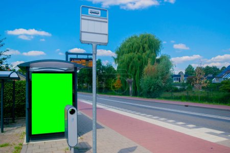 Photo for Empty billboard with chroma key at european bus stop, advertisement concept - Royalty Free Image