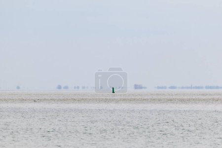 Photo for Buoy floats far away in the sea - Royalty Free Image