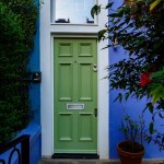 Brightly coloured traditional English house door in London. High quality photo