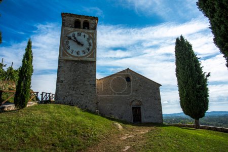 country church with bell tower with clock in the prosecco hills near Vidor Treviso Veneto Italy