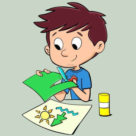 boy cuts colored paper with scissors and makes a collage