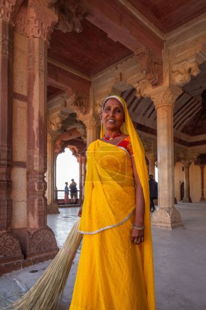 Photo for Amer, Jaipur, India 16 February 2024 middle-aged indian womam wearing traditional indina sari (also saree or shari) - Royalty Free Image