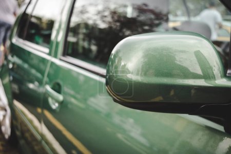 Photo for Detail of the side view of a car, with emphasis on the rear view mirror. - Royalty Free Image