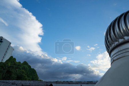 Photo for Cloud Blue sky and Roof Ventilator on roof of industryfor cooling in a natural way by relying on natural winds, selective focus and Low angle shot - Royalty Free Image